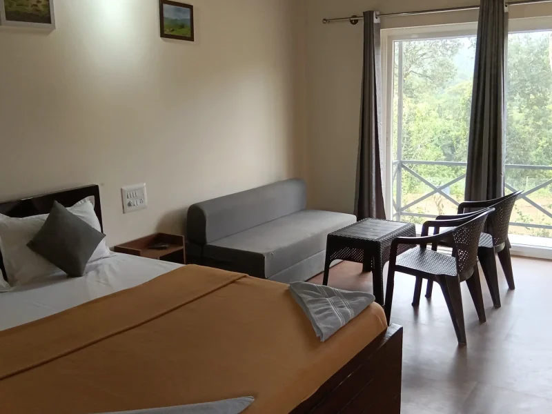 Family and couple cottage room at Himabindu Plantation Homestay Sakleshpur with balcony view